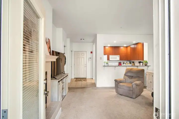 Living area looking from patio to front door