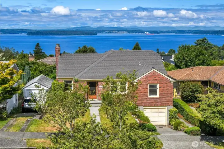 Classic brick Cape Cod style mid-century bungalow with views of Puget Sound and the Olympics
