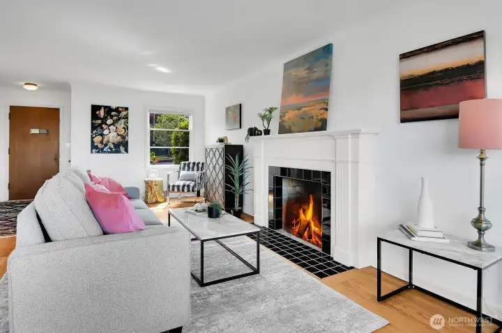 Wood burning fireplace and coved ceilings add charm
