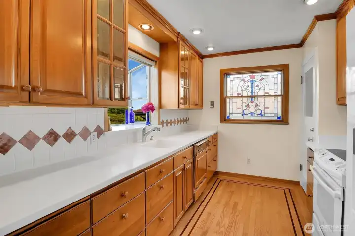 Remodeled kitchen with Corian counters and newer appliances