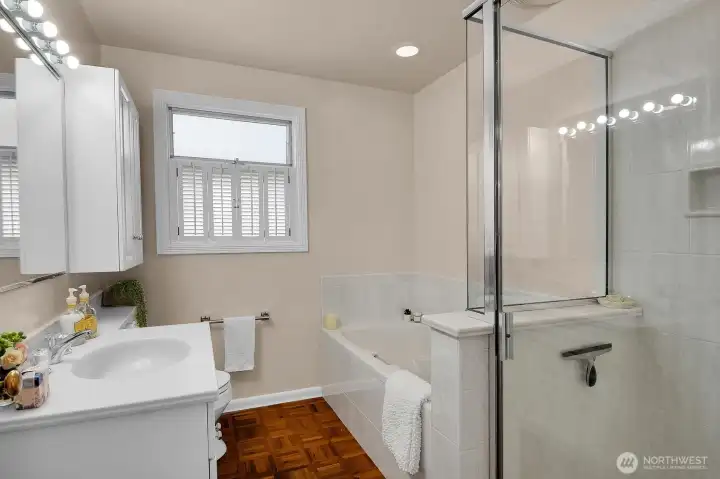 Updated bath with a jetted tub and shower