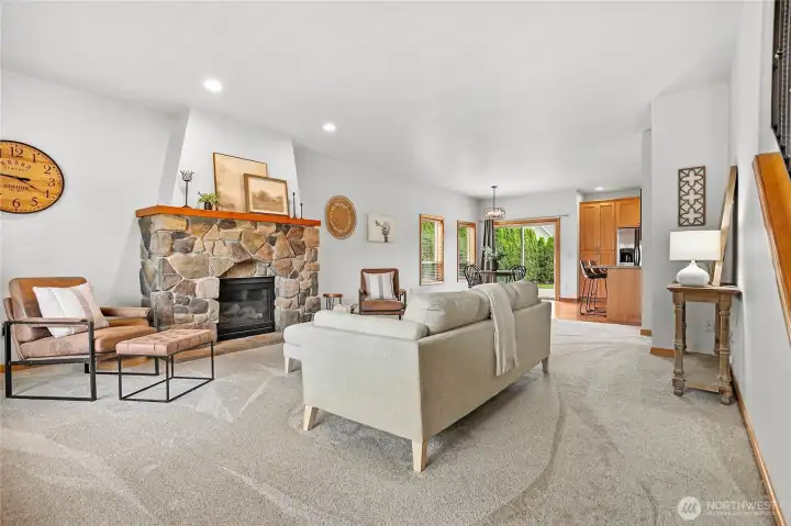Stone wrapped fireplace is the heart of this room!