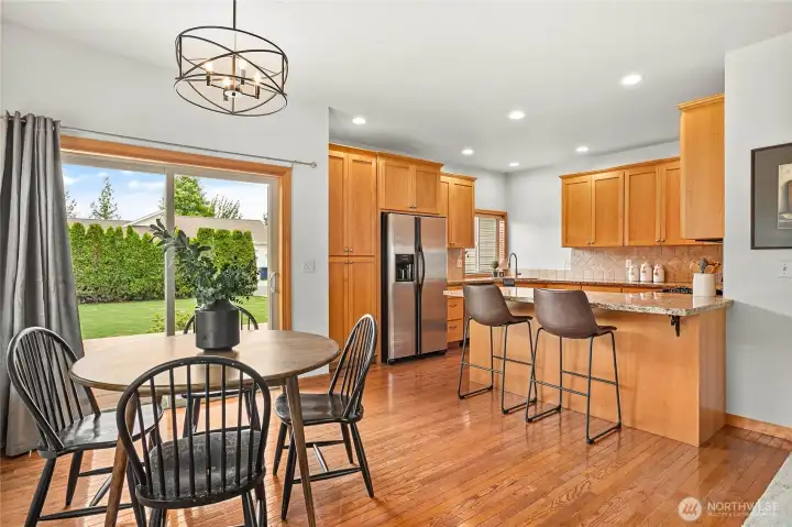 The spacious kitchen offers abundant workspace, bar seating, and everything you need to prepare your favorite meals.