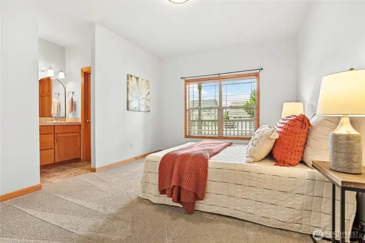 Retreat to your private main-floor primary suite featuring a walk-in closet and ensuite bath.