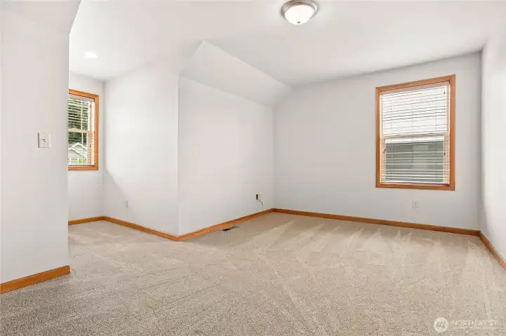 Generously sized bedrooms provide comfortable spaces for family, guests, or hobbies.
