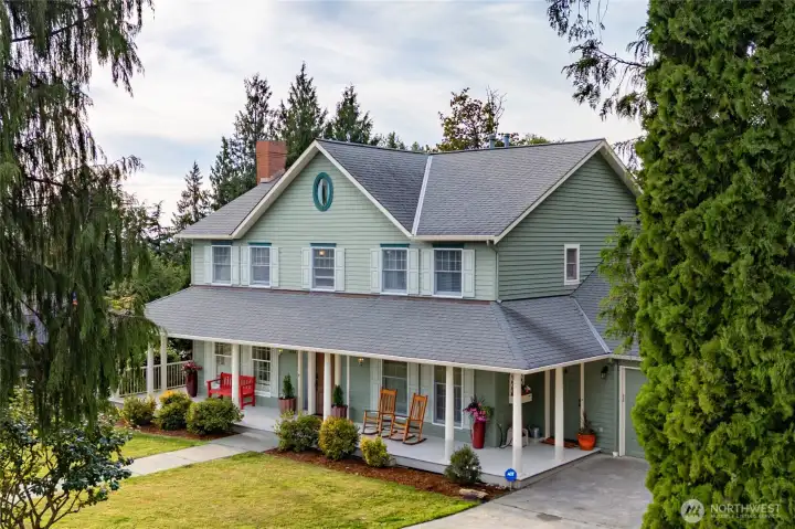 Traditional architecture is complemented by a functional covered front porch. Traditional architecture is complemented by a functional covered front porch.