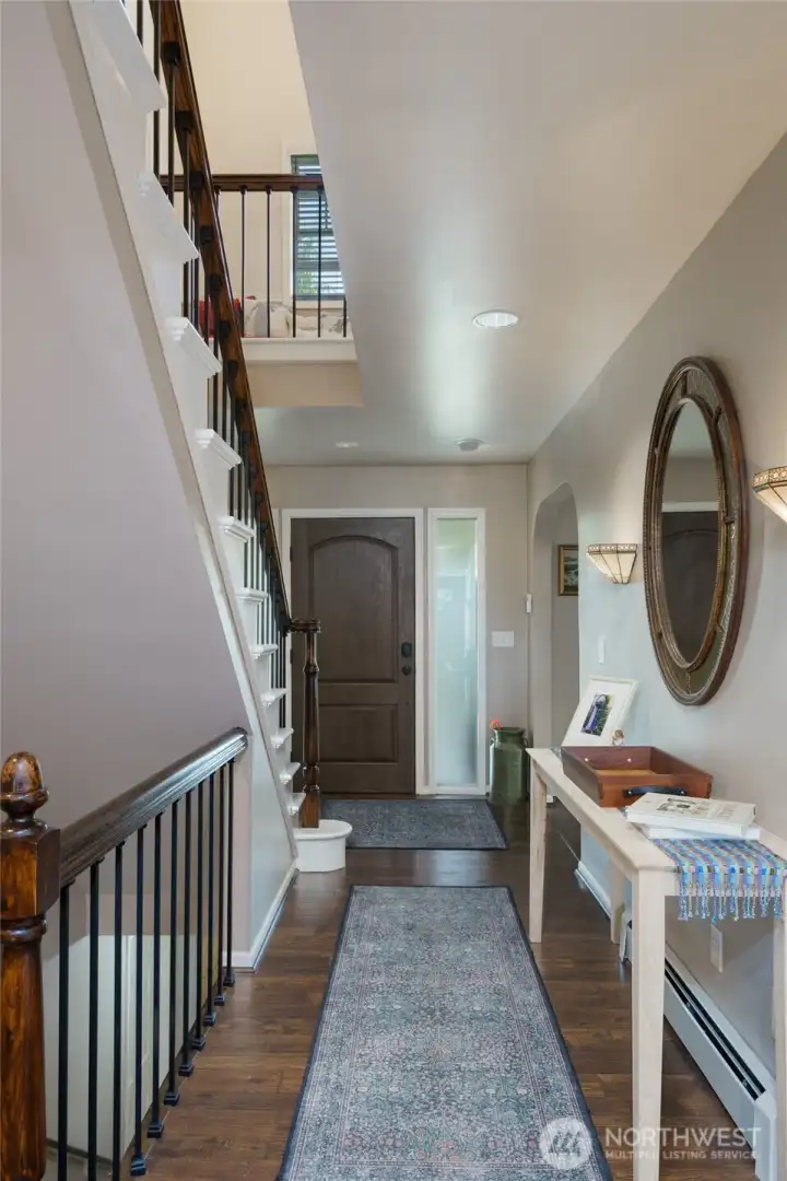 Vaulted foyer with a transom window fills the space with natural light. Vaulted foyer with a transom window fills the space with natural light.