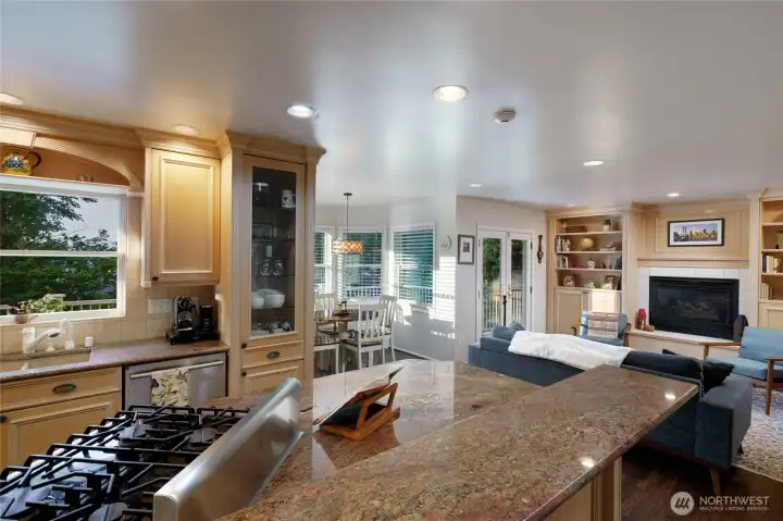 The kitchen with stainless steel appliances flows effortlessly into the family room and breakfast nook & French doors leading out to the deck. The kitchen with stainless steel appliances flows effortlessly into the family room and breakfast nook & French doors leading out to the deck.