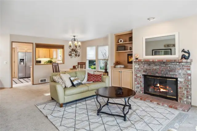 Living room with fireplace to warm up when the weather is cold.