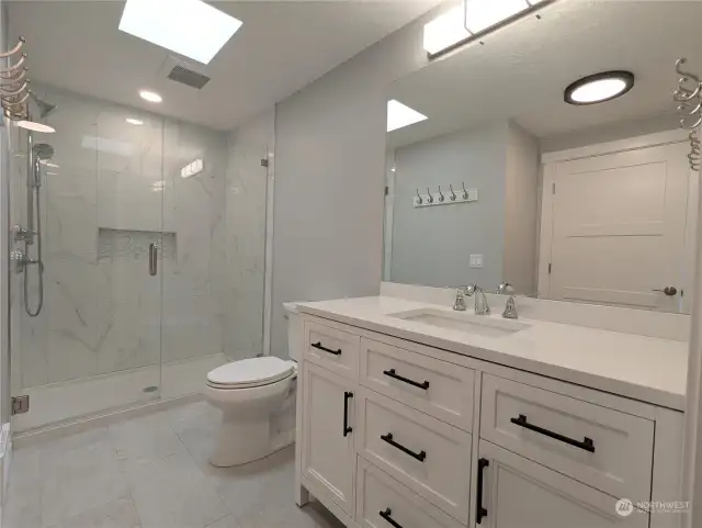 Primary Bathroom with quartz vanity