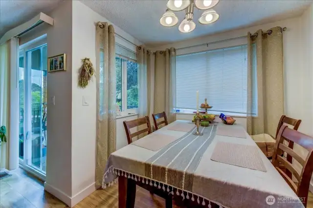 Unit 2 . Dining area and entry to the balcony.