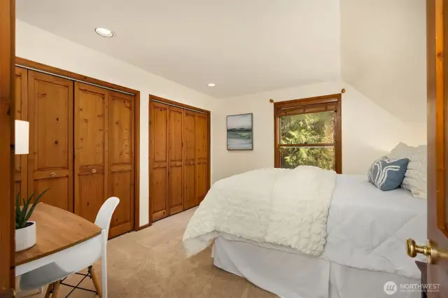 One of 2 upper level bedrooms had a view of the pond below.