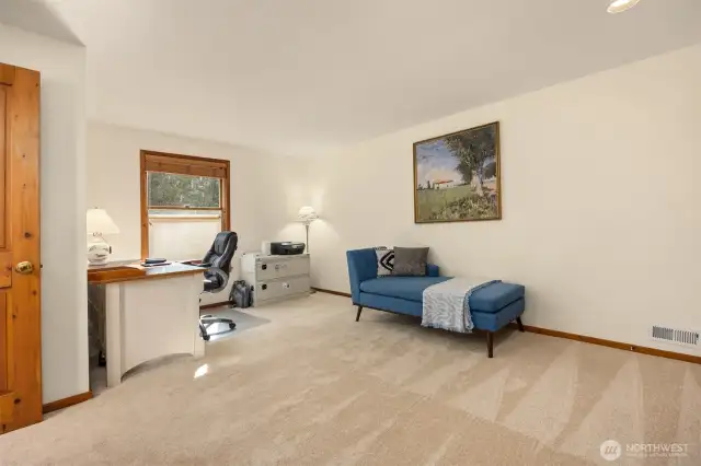 The second upper level bedroom is very spacious and is currently used as a home office. Lots of closet space.