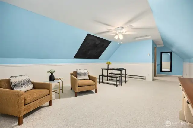 Don't miss the large bonus room located off the hallway to the primary bedroom. Vaulted ceilings and lots of room for crafts, media room, home office or gym. The black area is a chalk paint to keep track of your projects and crafts.