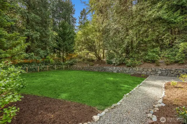 Not only is there an entertaining deck, but there is also a large grass play and garden area which is fully fenced. The mature landscaping provides great privacy.