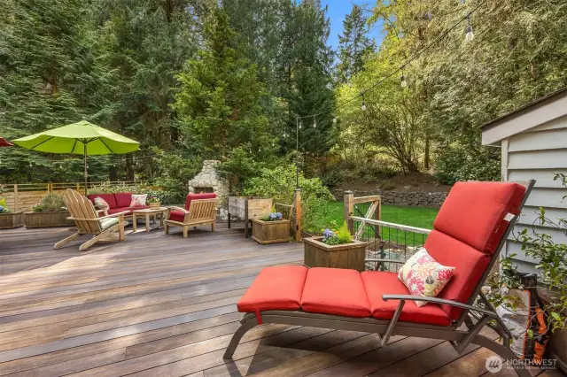 You will LOVE this large deck with several seating areas and overlooking the fenced grass play area.