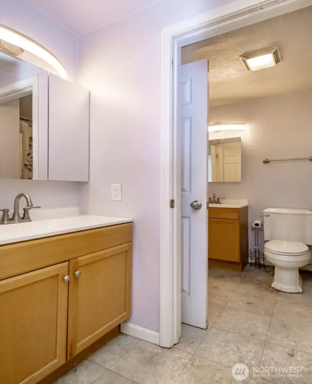 Primary bedroom half bath looking to main bath