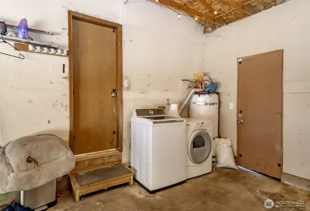 Laundry located in garage off dining room.