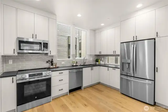 Gourmet kitchen with quartz counters, high-end appliances, and custom cabinetry.
