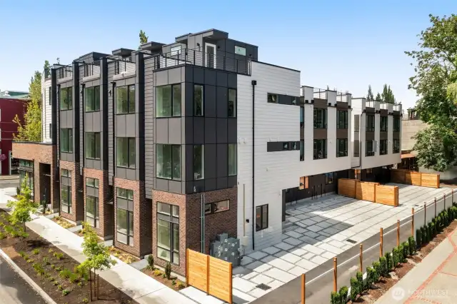 Clean lines, varied materials, and thoughtful landscaping create strong curb appeal and a welcoming presence in a peaceful residential setting.