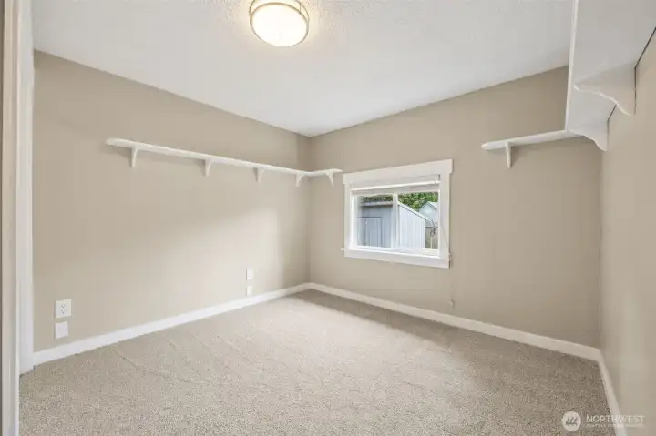 Same room w/out staging. Built in shelves stay!