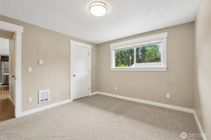 A look at bedroom #3's closet (it is a walk in). Any one of these rooms can also be used as an office (septic only rated for 3 bedroom house but all rooms have closets).