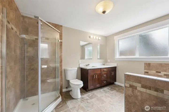 Primary bath has a standing shower, dual vanity, and a separate tub!