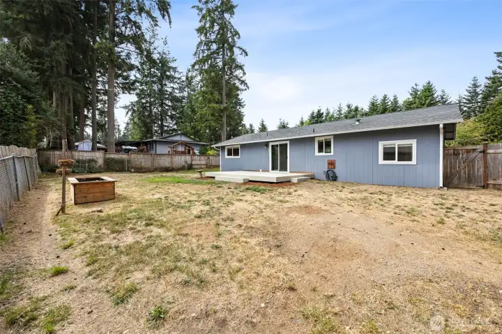 This yard is perfect for entertaining and there is so much room for activities/gardening/BBQ's you name it! (Flower box has since been removed)