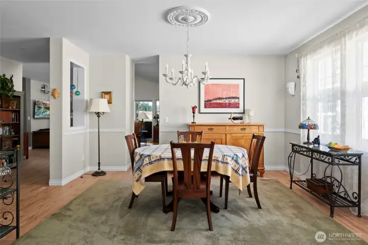 Close up of formal dining area. You can enter the family room through the hallway and the kitchen through the open doorway.