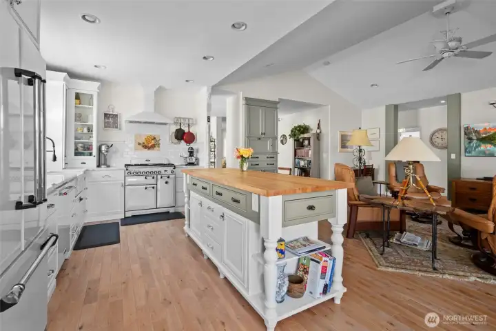 In addition to custom built cabinets, the Island is custom designed and built with a butcher block surface. Look at all the storage it has.