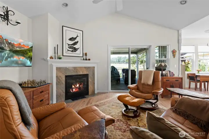 What a wonderful space for relaxing. Vaulted ceilings and fan adorn this room.  Through the sliders is the covered patio.
