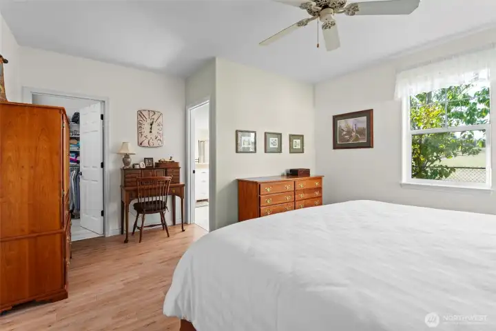 On the other side the open door is the larger of the two walk-in closets.