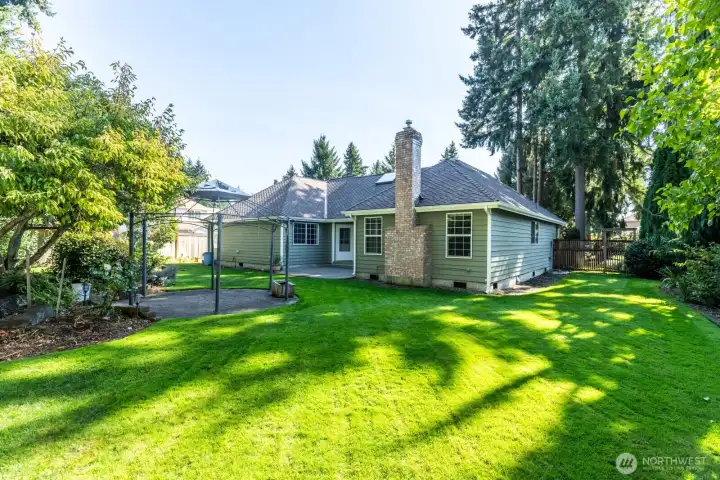 Large backyard showing gazebo and patio.