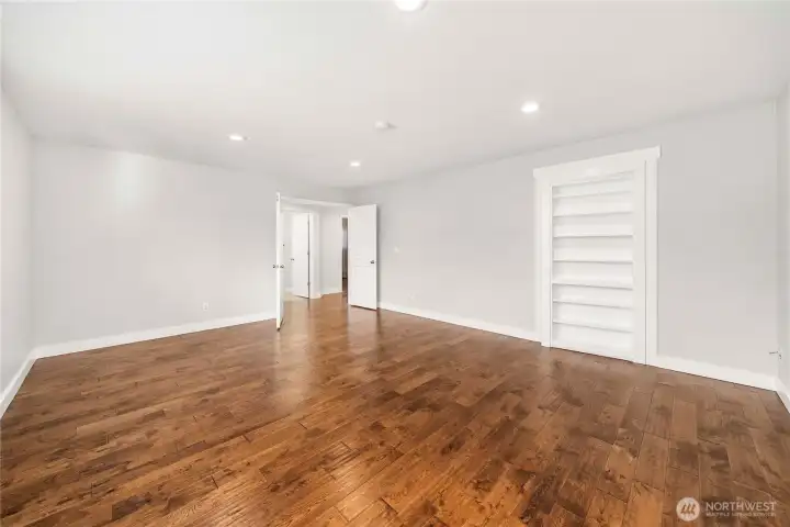Bonus room with walk-in closet behind bookshelf