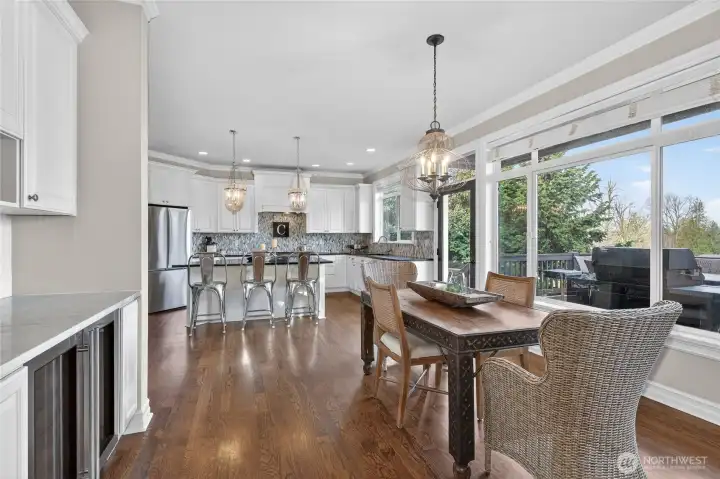 Gourmet kitchen opens into family room & built-in wine bar