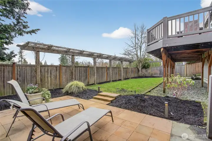 Large, level yard w/ lush green lawn & patio space.