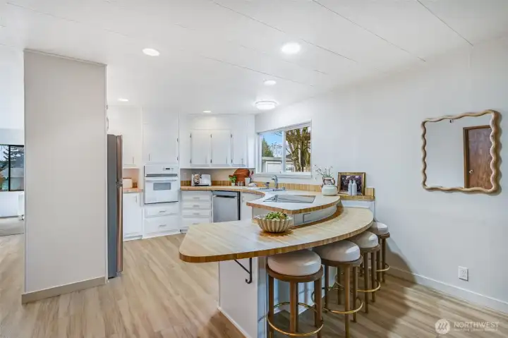 The kitchen with its new appliances is waiting for you. Eat at the bar, or just entertain the cook.