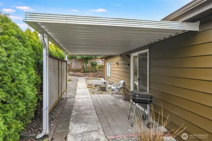 The patio has a cover to keep you dry when nature offers liquid sunshine.