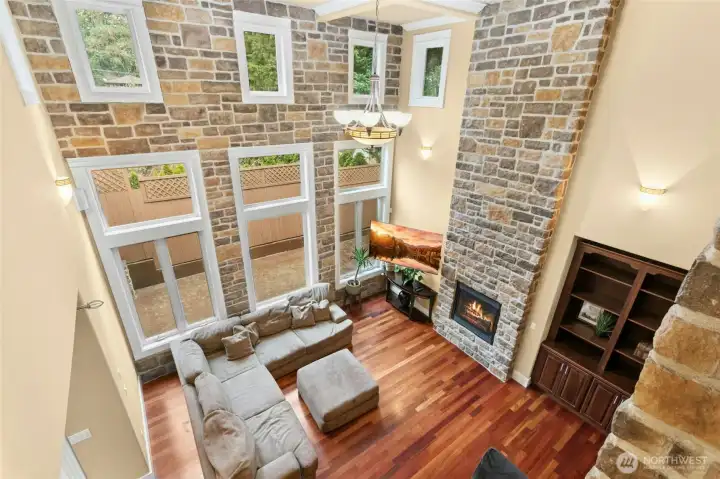Grand living room with an open second-floor overlook, creating a stunning sense of space and light.