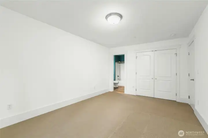 Spacious secondary bedroom with a large walk-in closet.