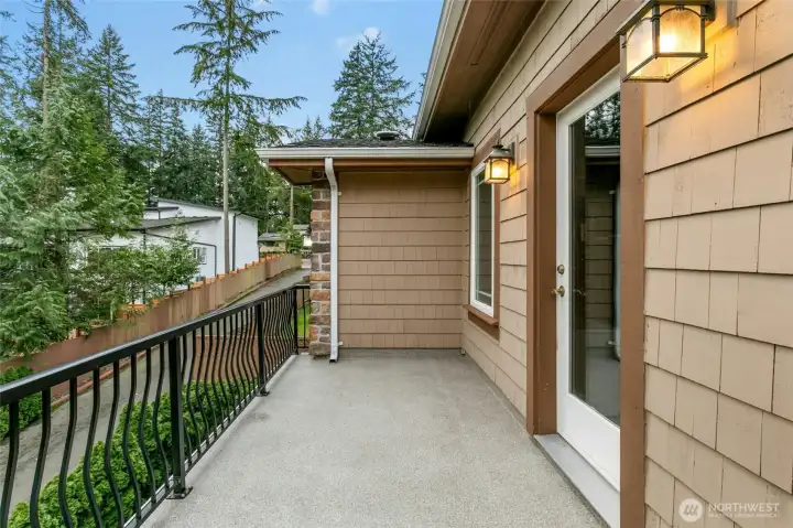 Elegant Romeo and Juliet balcony with direct access from a secondary bedroom, currently utilized as a private office.