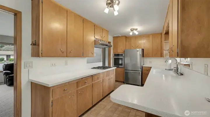Kitchen offers ample cabinet and counter space.