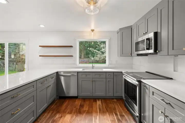 New cabinets, appliances, counters, window, lighting and paint