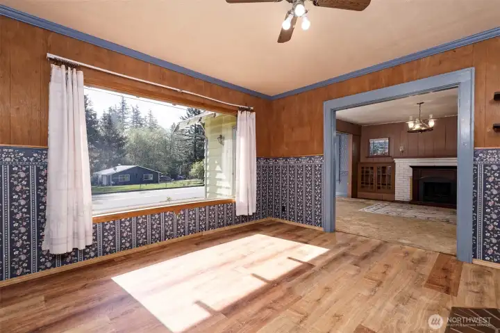 Positioned just off the main living area and kitchen, this versatile space works well as a dining room or extra living area and features a freestanding pellet stove.