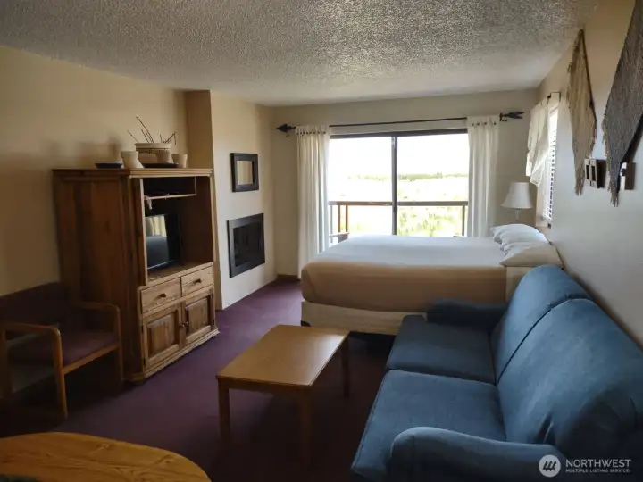 Great room with sunset views and cozy fireplace.