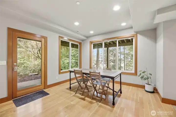 Lower level dining with a lake view. Lower level dining with a lake view.