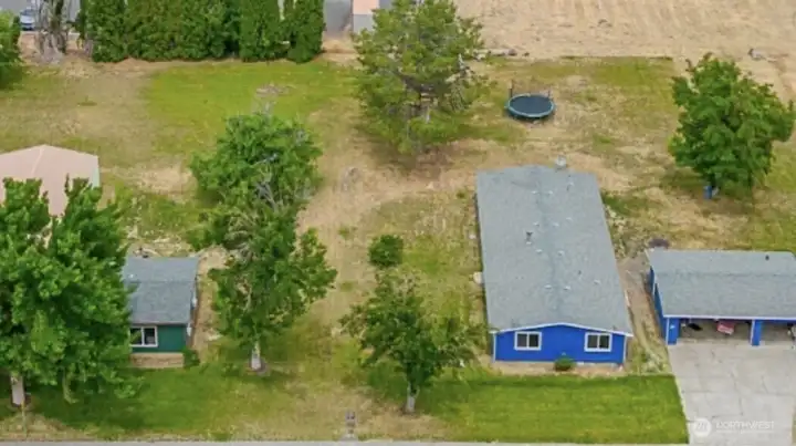 2 Homes, 3 car garage, & 3 Bay heated shop with 220 on approximately 1 acre zoned RM in town