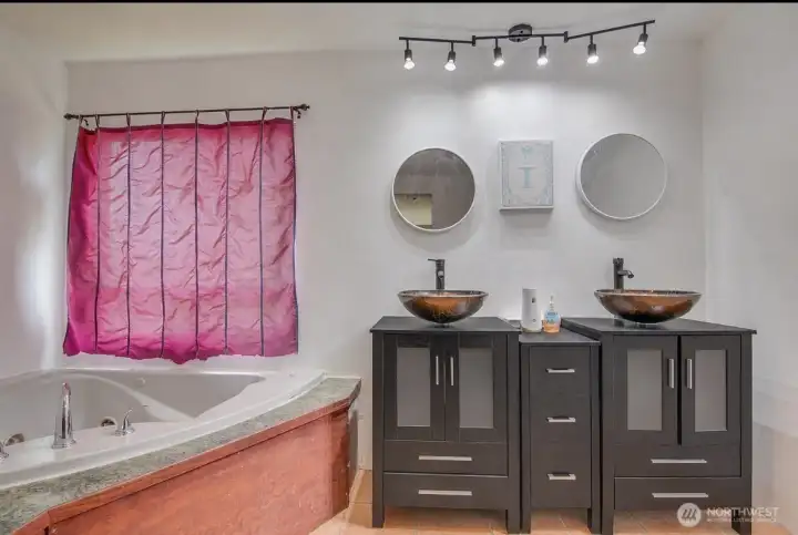 5 piece master bath has double shower heads, jacuzzi tub, & bidet toilet with heated seats