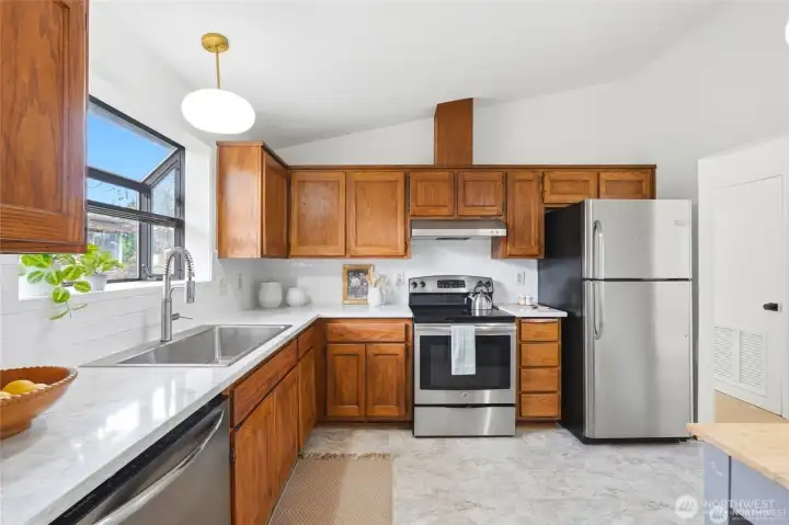 Step inside to find a beautifully updated interior boasting remodeled bathrooms, fresh paint, new carpet, and timeless granite countertops that create a warm, welcoming atmosphere throughout.