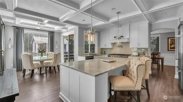 Kitchen overlooking the breakfast nook and serene outdoor space.